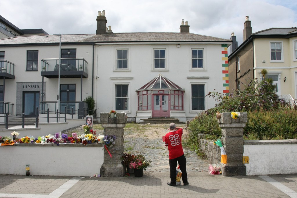 Mourners outside of Sinead O'Connor's former home in Bray, Irelannd
