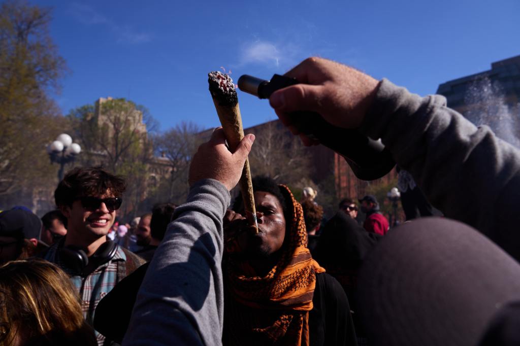 People celebrating 4/20 World Cannabis Day in New York City's Washington Square Park.