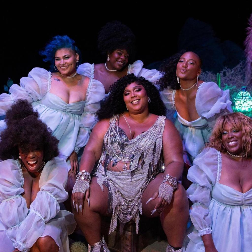 lizzo, pictured in the center, and her dance team