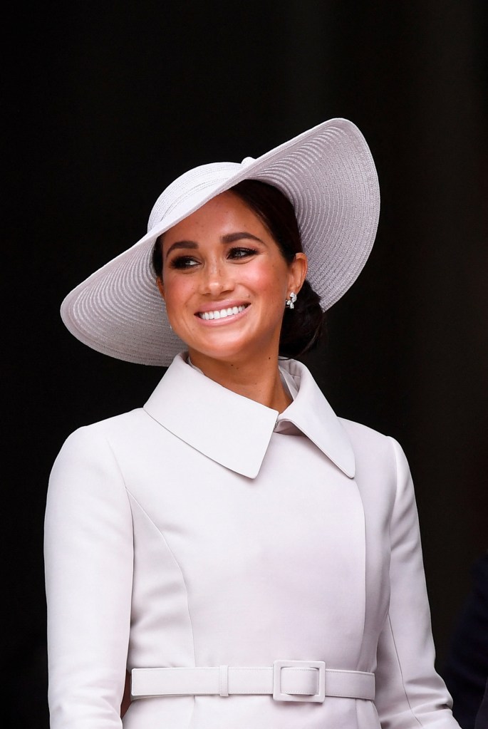 Meghan Markle smiling at the camera. 