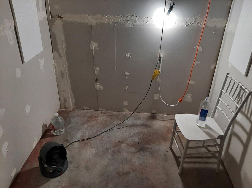 FBI officials said the woman was able to escape by beating down the door of the cinder block cell where Zuberi chained and sexually assaulted her.
