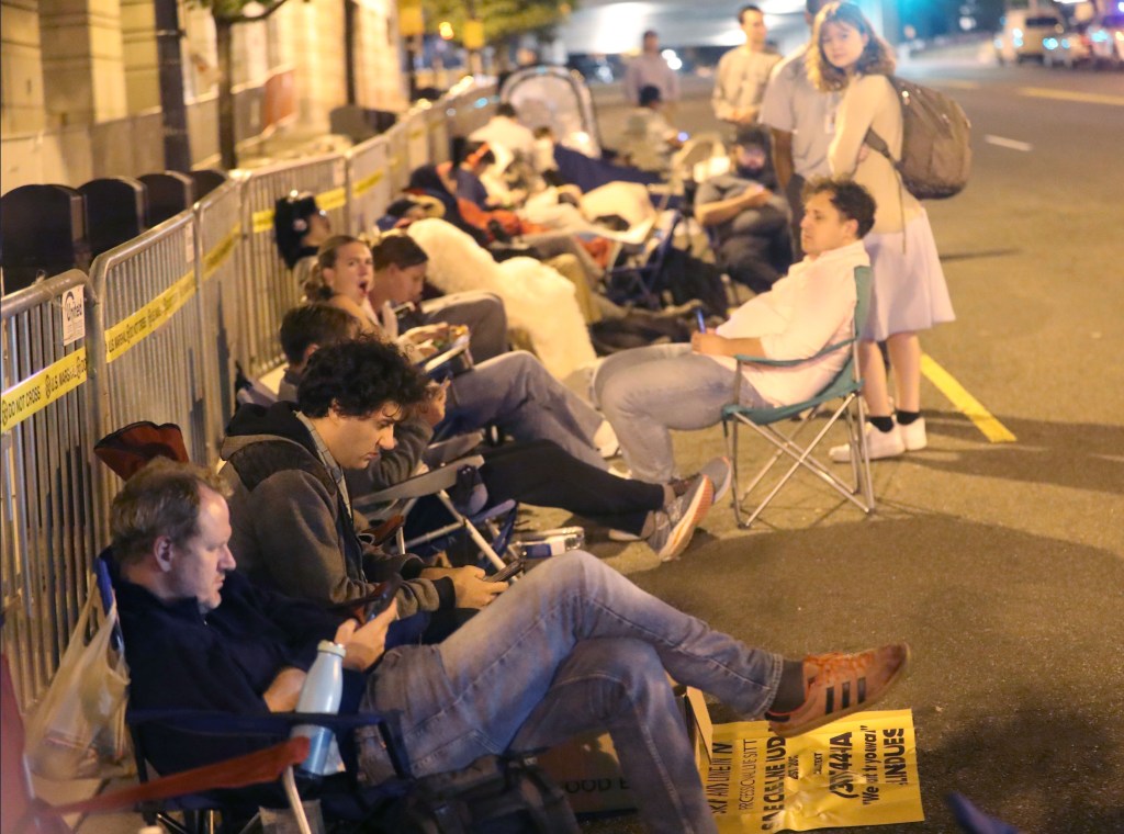 People waiting for hours on the sidewalk or in folding chairs in anticipation of the hearing.