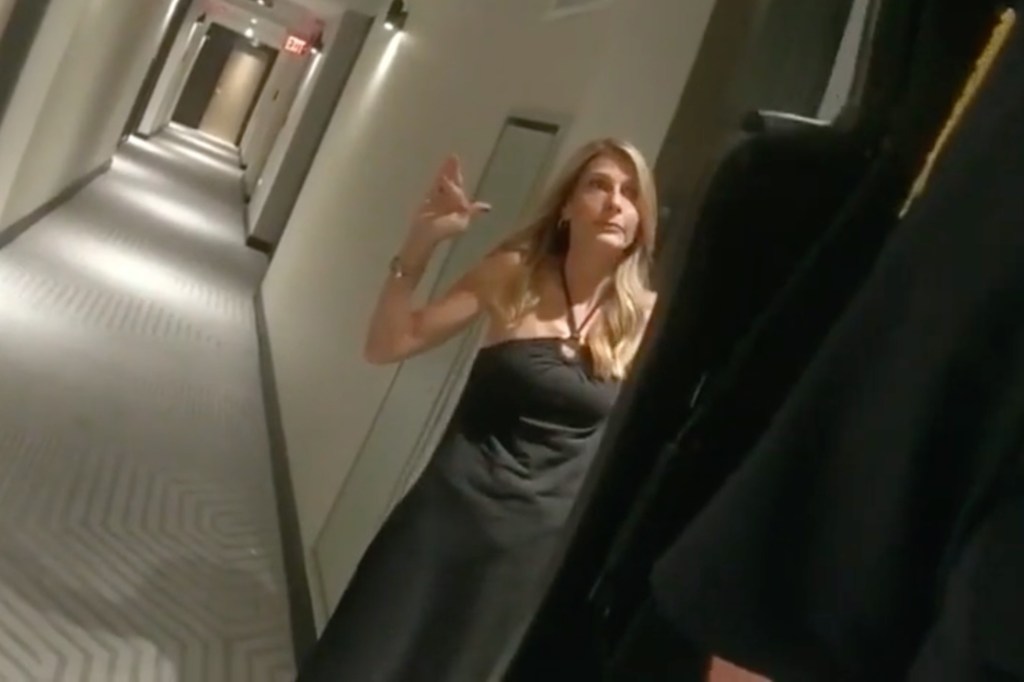 Jody Ramirez is seen leaving her hotel room with her hands up. 