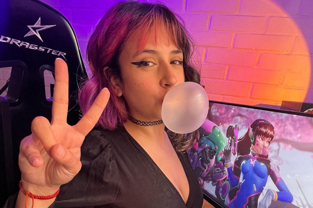 María Ignacia Celedón blows a gum bubble and makes a peace sign 