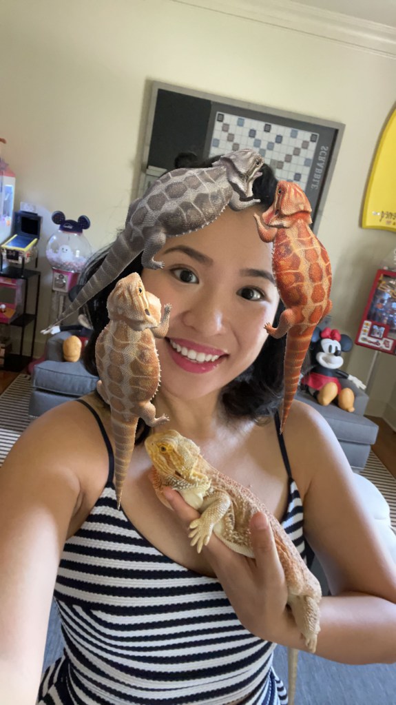 Cyrene Quiamco, also known as CyreneQ, with Rambo, the bearded dragon, and a lizard filter. 