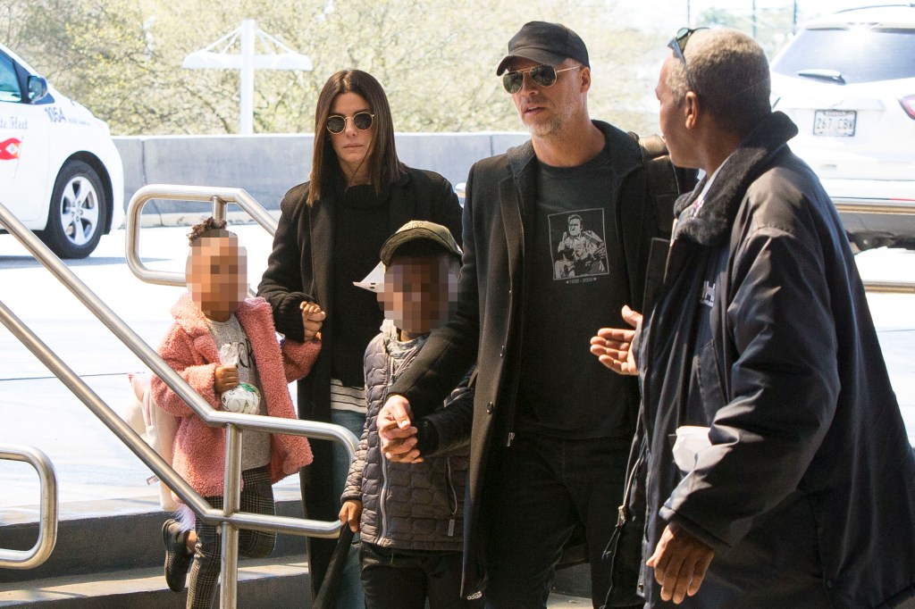 EXCLUSIVE: Sandra Bullock and her children, Louis and Laila, are accompanied by 'boyfriend' Bryan Randall and her bodyguard through Louis Armstrong International Airport in New Orleans, Louisiana
