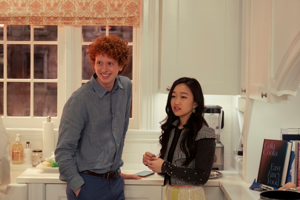 Lily and Brady talk in the kitchen.