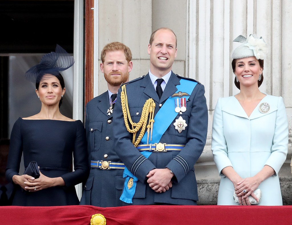 Photo of Prince Harry, Meghan Markle, Kate Middleton and Prince William standing on the balcony of Buckingham Palace. 