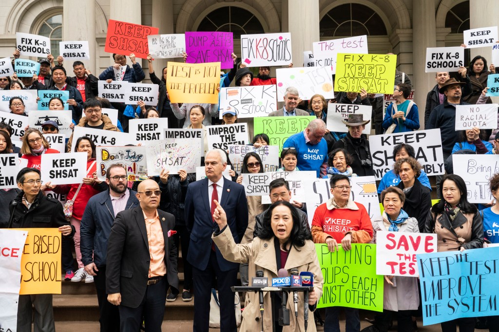 Chin speaking at a rally at City Hall against the de Blasio administration's plan to end the Specialized High School Admissions Test in 2019.