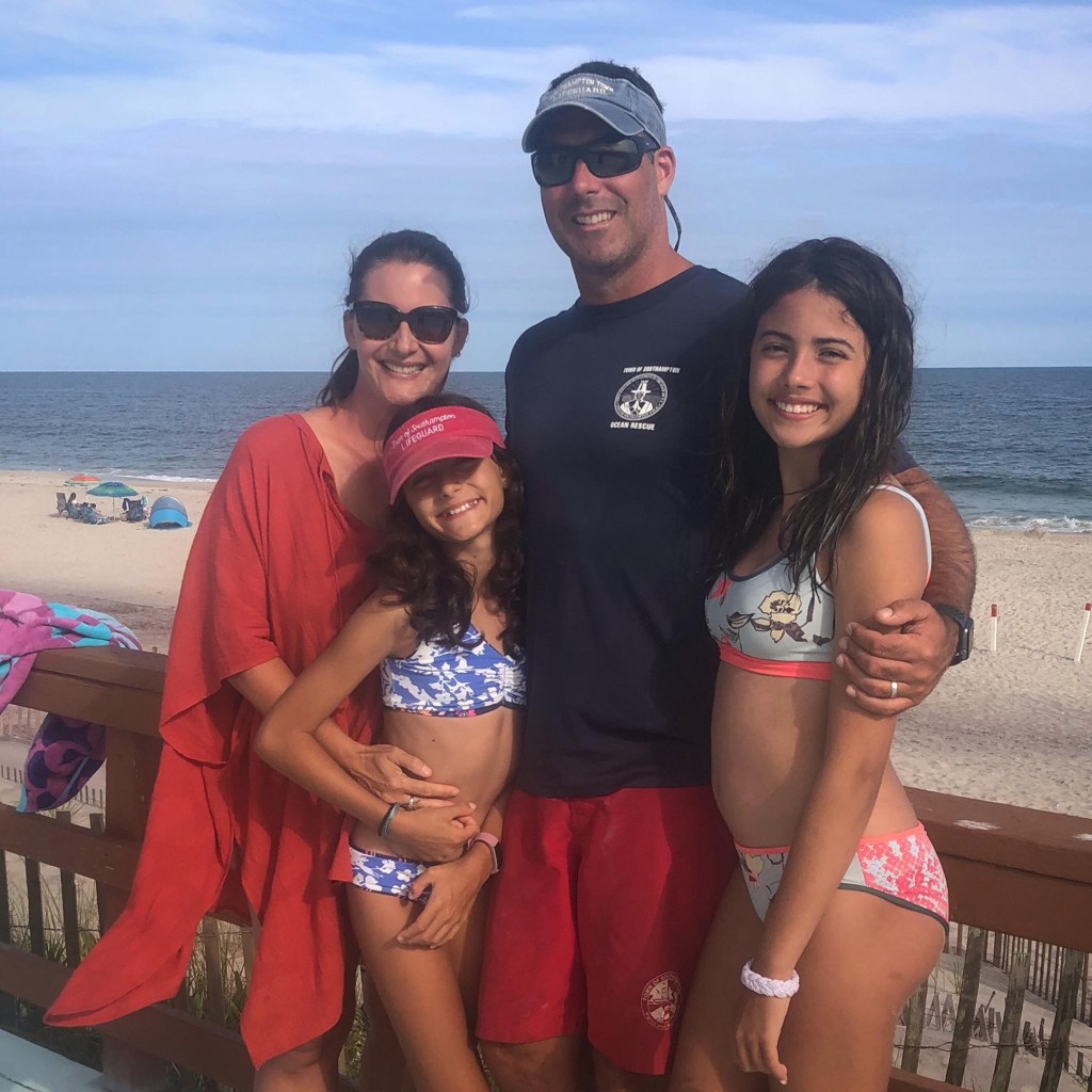 Pam Reader (far left), her husband, and two daughters.