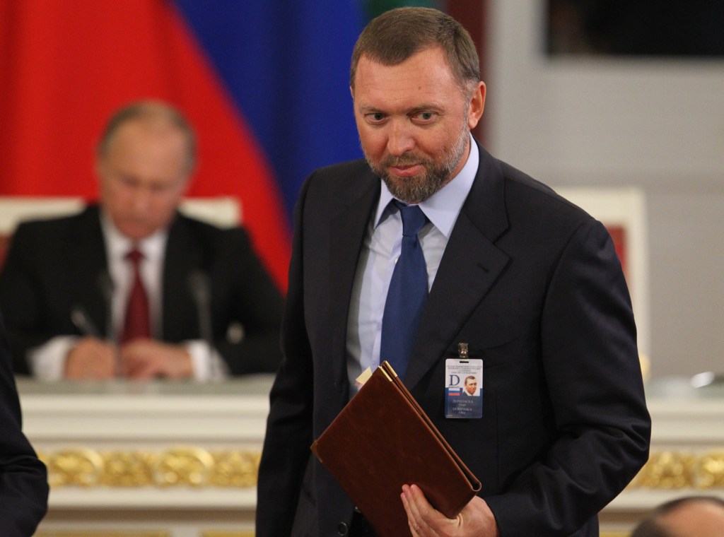 Russian billionaire and businessman Oleg Deripaska attends a meeting with Chinese President Xi Jinping and Russian President Vladimir Putin.