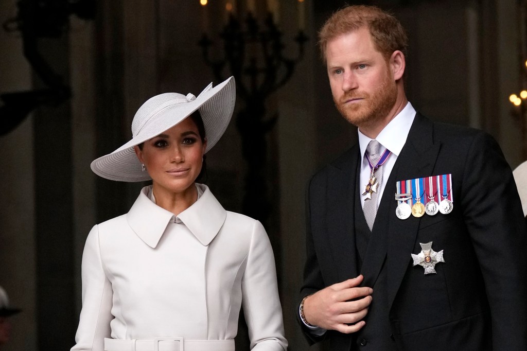 Photo of Meghan Markle next to Prince Harry. 