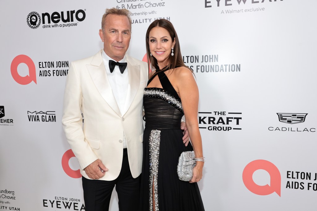 Costner and Baumgartner attend the Elton John AIDS Foundation's 30th Annual Academy Awards Viewing Party on March 27, 2022.