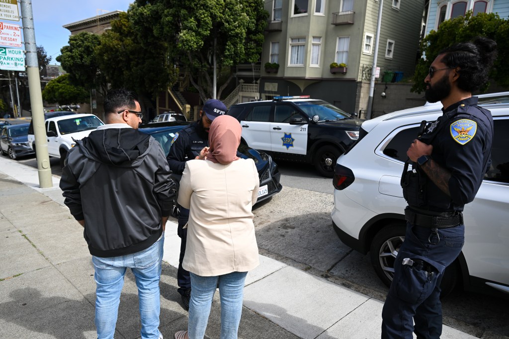 FILEâSAN FRANCISCO, CA - AUGUST 9: Police take information from the tourist couple whose car was smashed and belongings were stolen in Alamo Square of San Francisco, California, United States on August 9, 2023. 