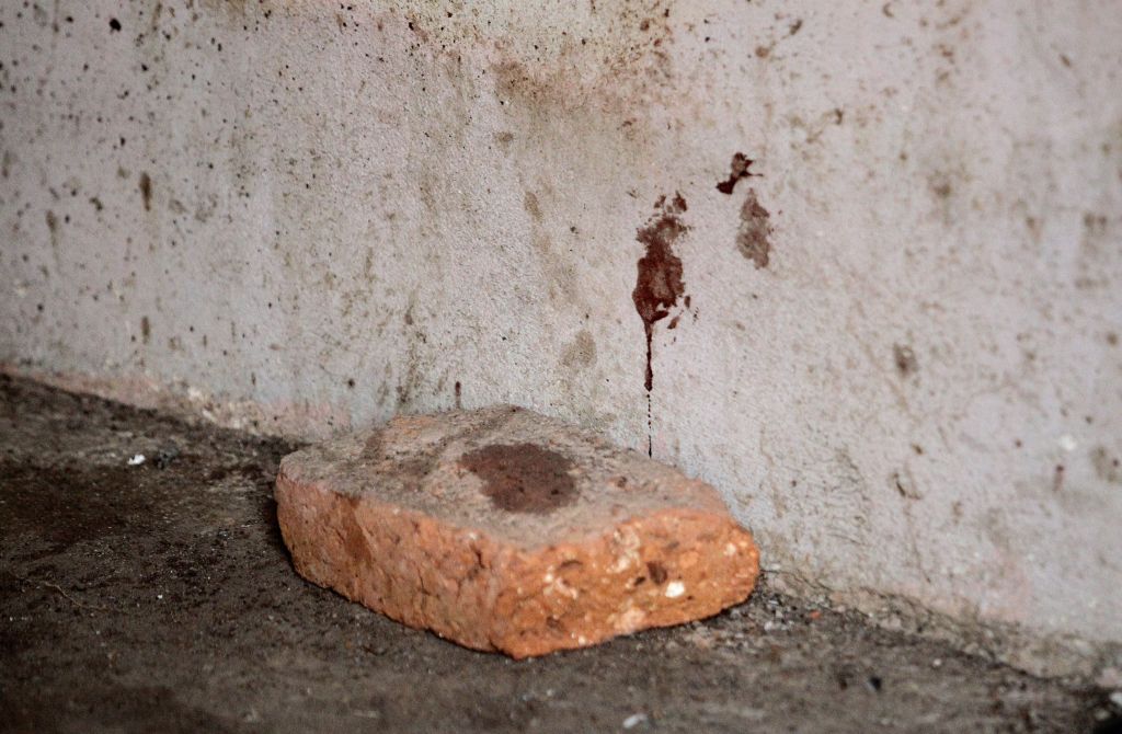 Blood stains are seen in the house where allegedly five young men were murdered in Lagos de Moreno, Jalisco State, Mexico, on Thursday.