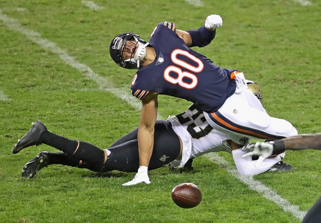 Jimmy Graham #80 of the Chicago Bears drops a pass as he is hit by Marshon Lattimore #23 of the New Orleans Saints at Soldier Field on November 01, 2020.