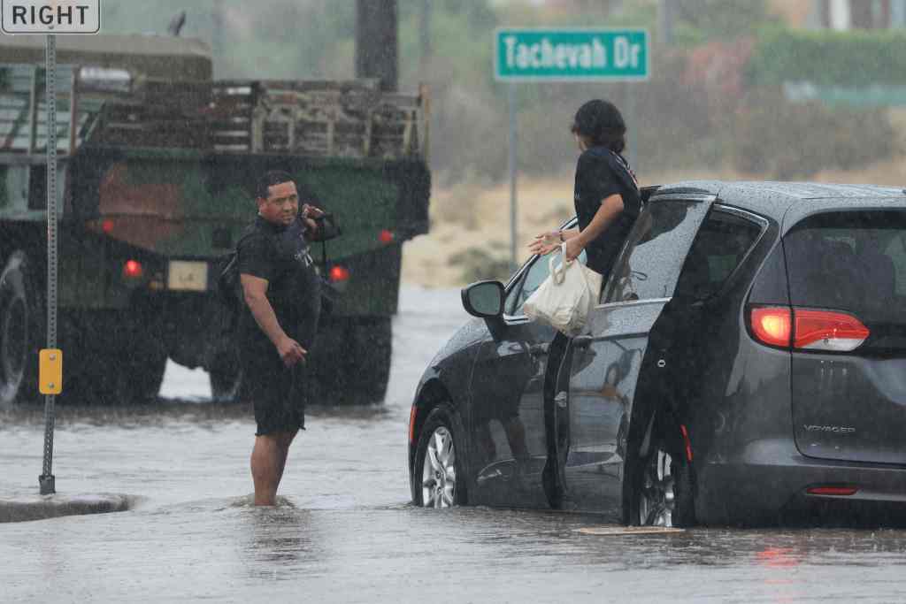 Motorist leaving their stuck vehicles on a road in Palm Springs.