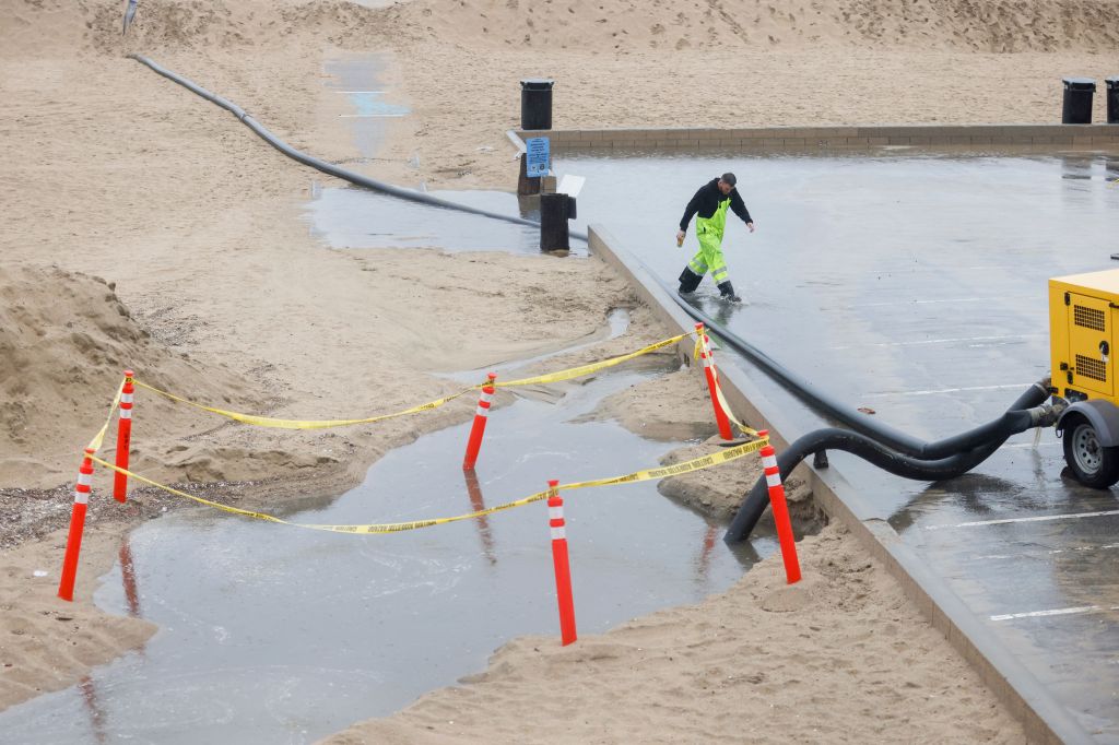 Water getting drained from flooded walkways in Seal Beach, California.