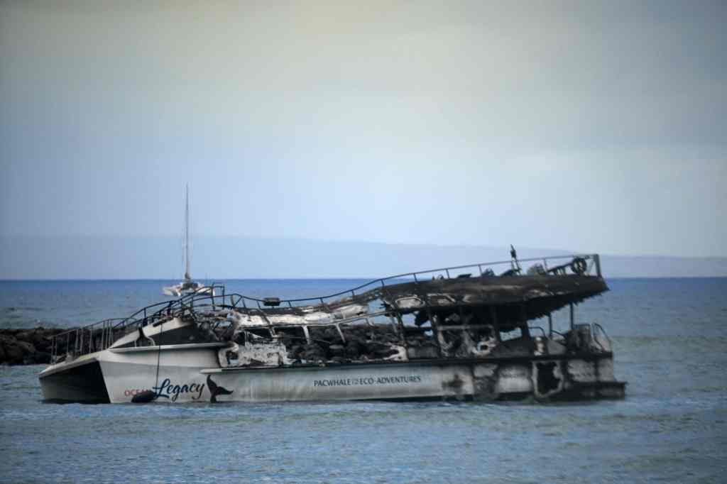A burnt ship is pictured off Front Street in Lahaina, near where several survivors had to jump into the sea to avoid the flames.