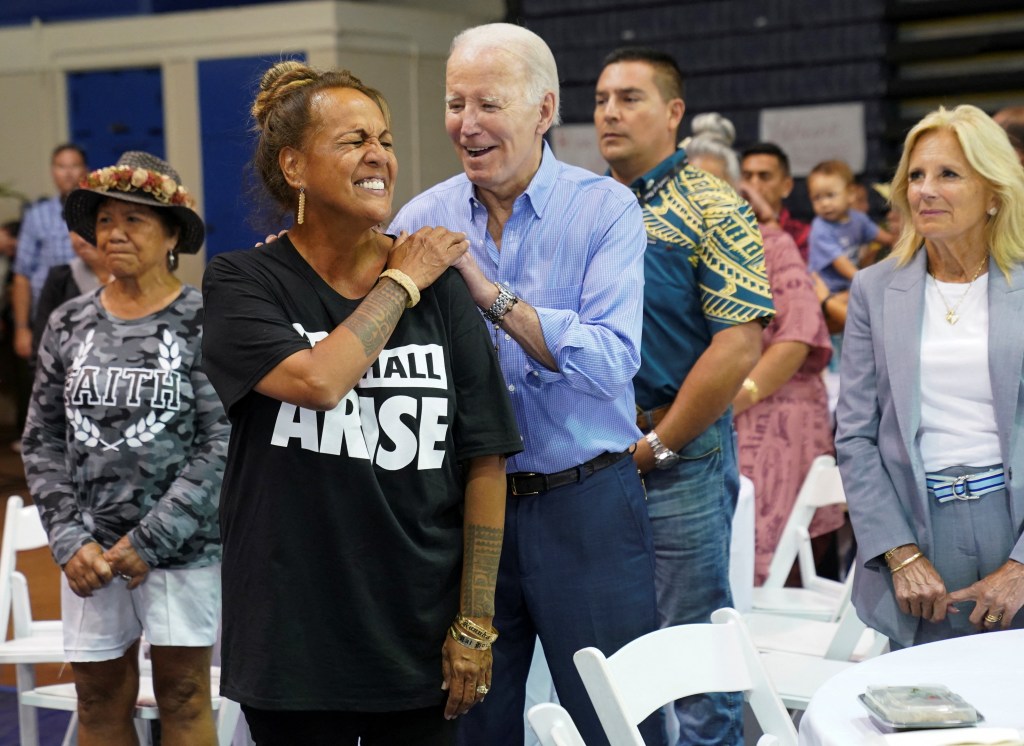 U.S. President Joe Biden reacts during a community event at the Lahaina Civic Center.