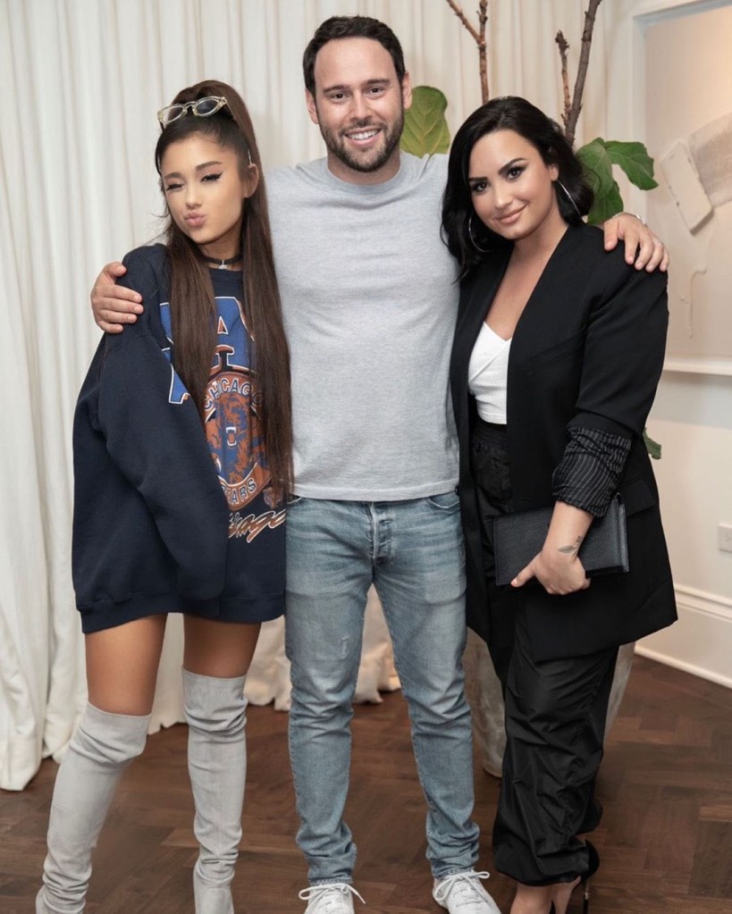Braun poses with Ariana Grande and Demi Lovato at a Kamala Harris 20/20 fundraiser hosted by Braun, in Los Angeles on July 20, 2019.