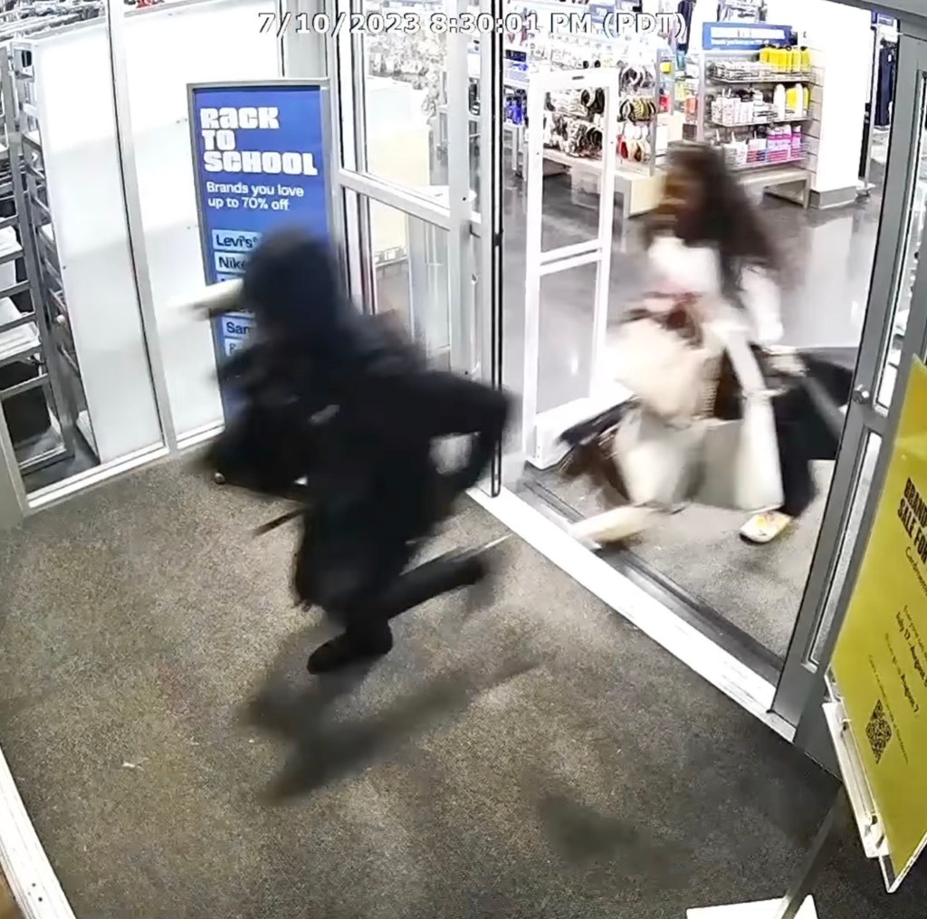 People running out of the store after robbing it.