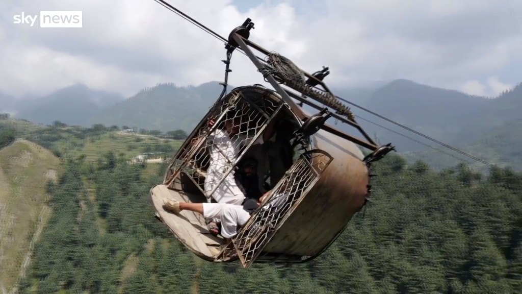 Trapped cable car passengers cling for their lives