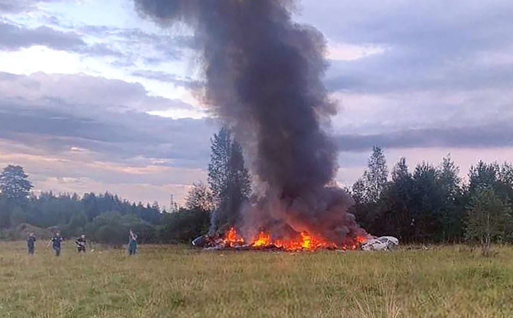 Fire engulfs the plane after the crash.