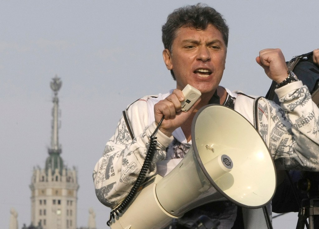 In this file photo taken on Sunday, May 6, 2012, Opposition leader Boris Nemtsov uses a loud speaker during an opposition rally in downtown Moscow, Russia.