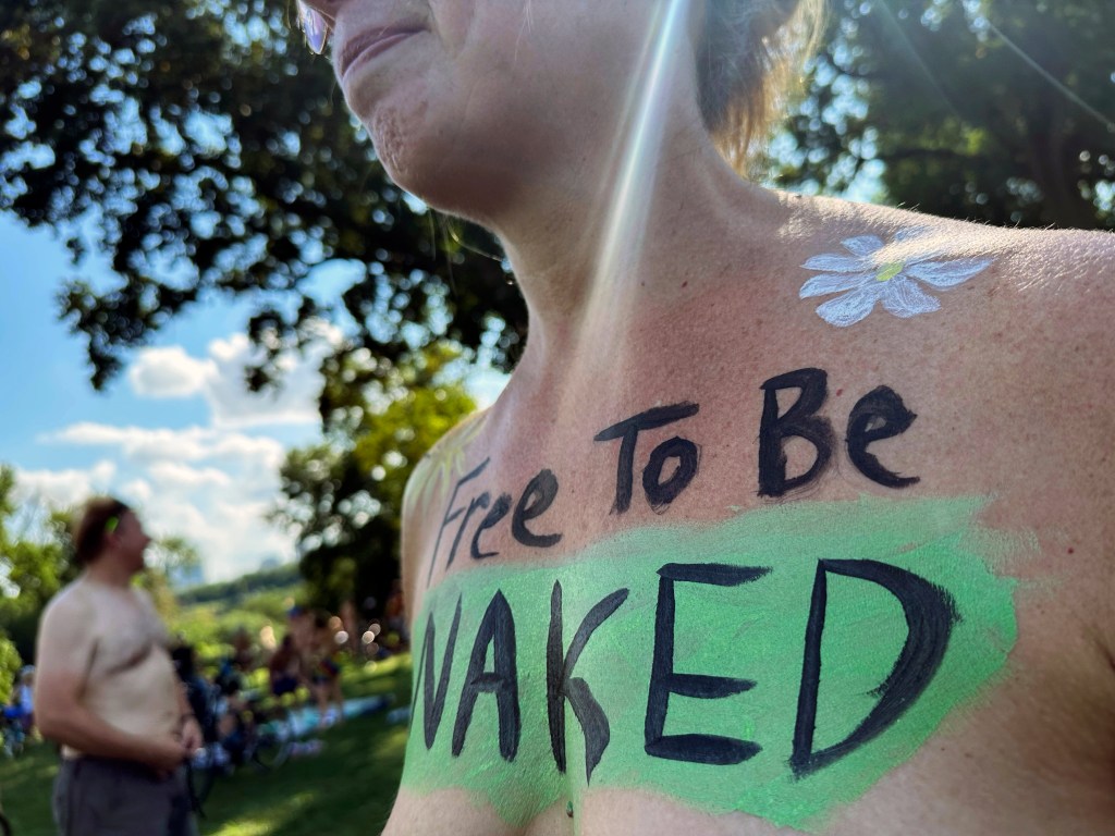 nude biker's slogan declares she's "free to be naked"