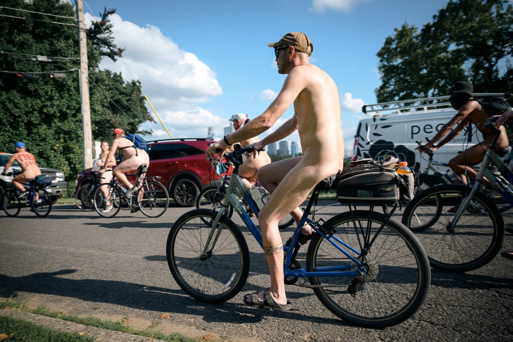 nude bikers are seen riding through the streets of Philly