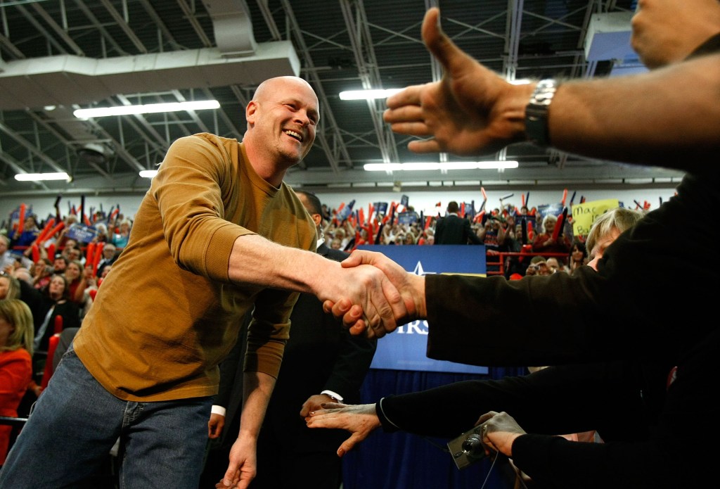 "Joe the Plumber" shakes hands with supporters during a campaign rally.