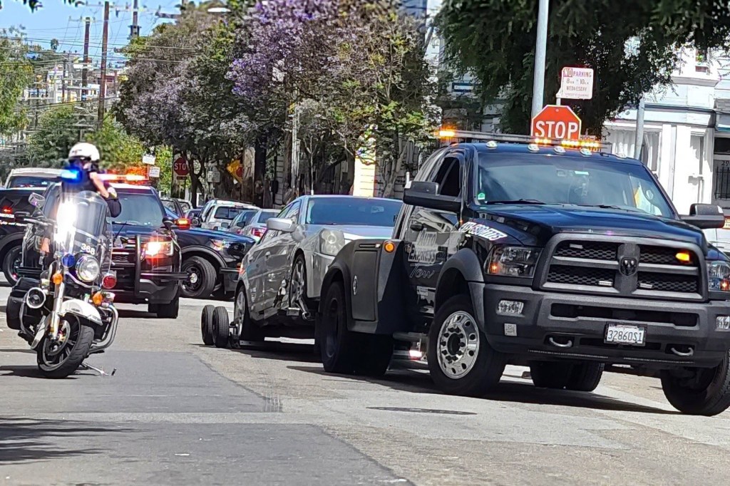 Cadillac being towed away