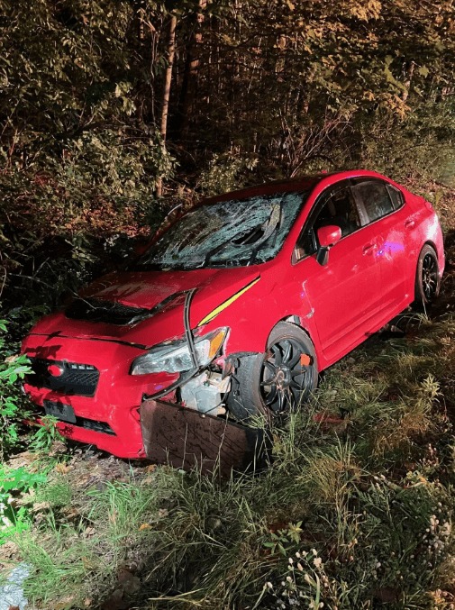 A red 2017 Subaru WRX slammed into the officers while they were handling a case off Route 202 in Hollis. 