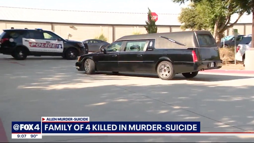 Hearse and police car at site of deaths