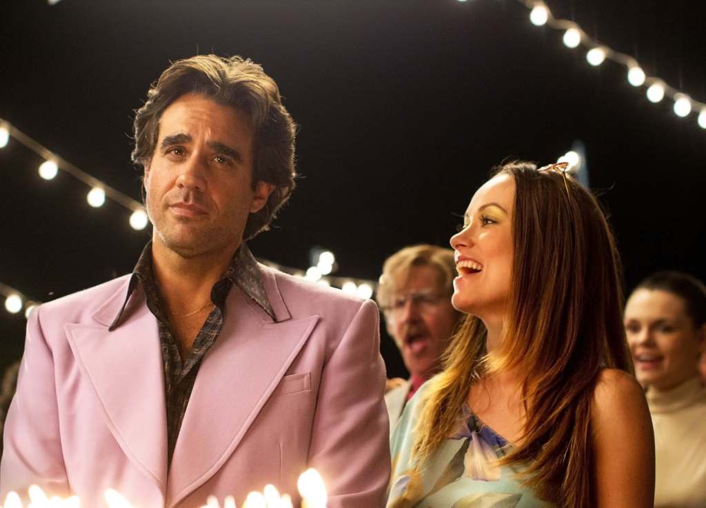 Bobby Cannavale and Olivia Wilde in "Vinyl" smile at each other. 