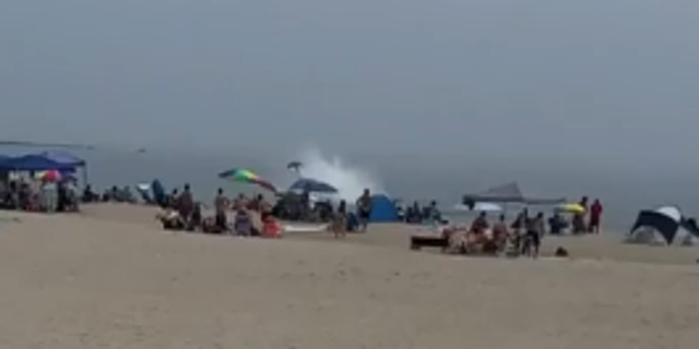 Tail of plane crashing into water