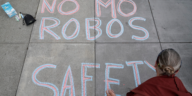 San Francisco sidewalk chalk protest against robotaxis