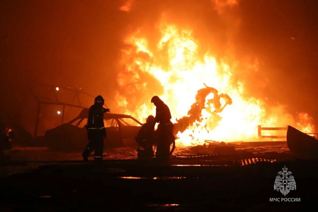 Firefighters are seen trying to extinguish the fire at the petrol station near Makhachkala, Russia, on Aug 14, 2023. 