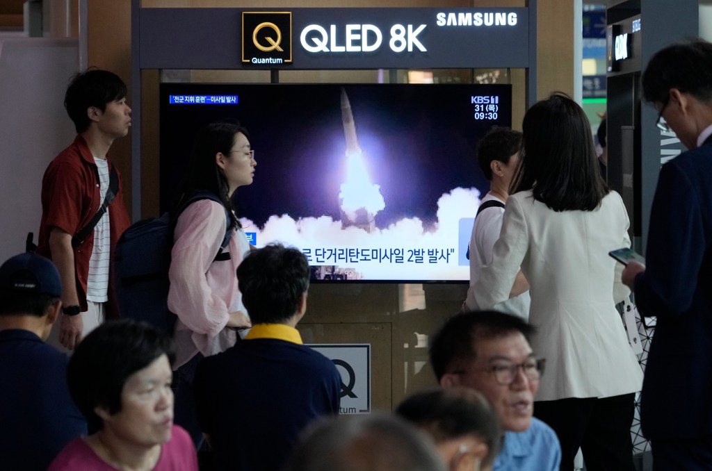 More people crowd around a television broadcasting North Korea's missile launch at Seoul Railway Station in Seoul, South Korea, on Aug. 31, 2023. 