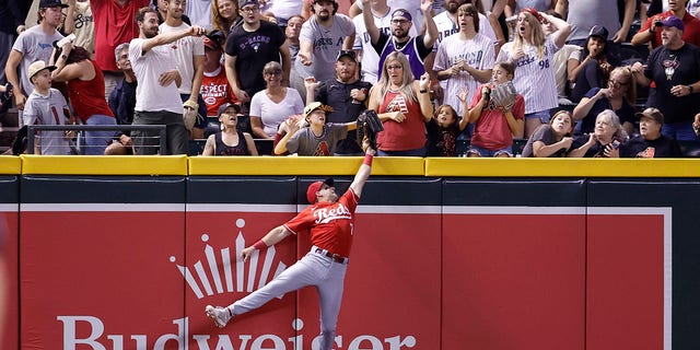 Spencer Steer tries to get a home run