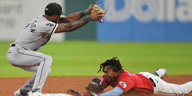 Jose Ramirez slides into Tim Anderson