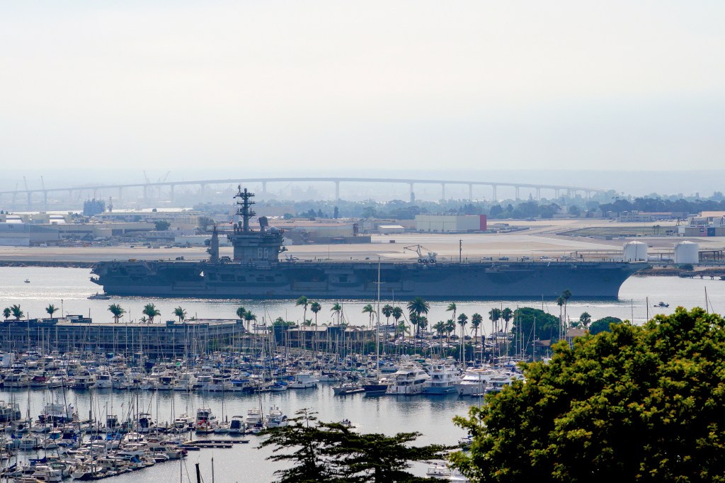 The USS Nimitz departs San Diego Bay on Saturday ahead of the hurricane making its way to the city.