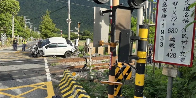 Damaged car near crossing