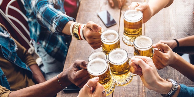 friends cheersing beer