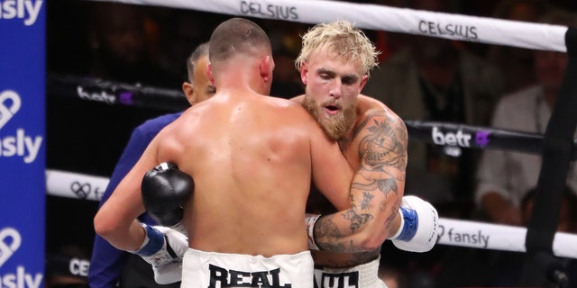 Jake Paul hugs Nate Diaz