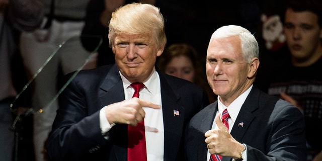 President-elect Donald Trump and Vice President-elect Mike Pence stand onstage