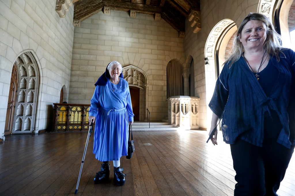 Sister Rita Callanan and restaurateur Dana Hollister walk inside the main room of a villa at The Sisters of the Immaculate Heart of Mary Retreat House on June 25, 2015 Los Feliz, California. The Sisters of the Immaculate Heart had sold their property to Hollister, but the Archdiocese of Los Angeles has argued that only they have the authority to sell the property, and plan to sell it to singer Katy Perry.