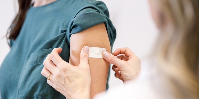 Woman getting vaccine