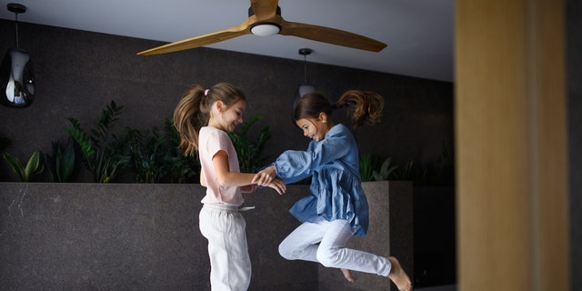 Kids jumping on bed